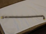 Titeflex 15" Stainless Braided Hose Flareless Fittings 1300PSI W/90 Elbow. Fixed Price $24.99.