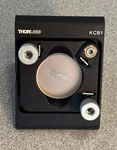 Thorlabs KCB1 Right-angle Kinematic Mirror Mount With PF10-03-P01. Fixed Price $99.00.